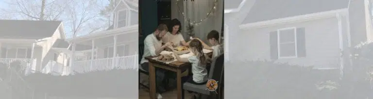 A family prays before their holiday meal